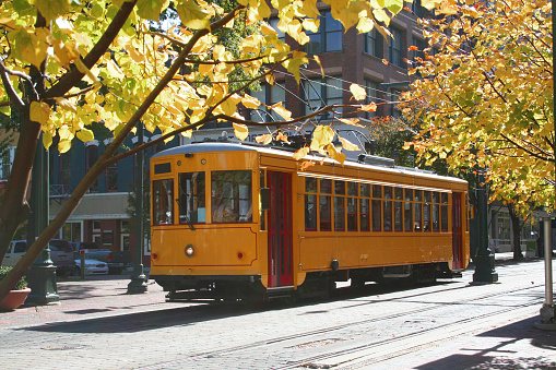 A historic yellow trolley in downtown Memphis, TN.