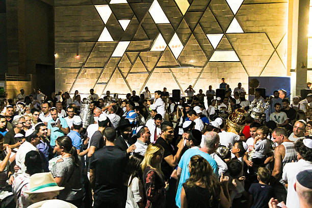 Men dance with Bible scrolls at Simhath Torah. Tel Aviv Tel Aviv, Israel  - October 5, 2015: Unidentified jewish  dance with Bible scrolls during the ceremony of Simhath Torah chupah stock pictures, royalty-free photos & images