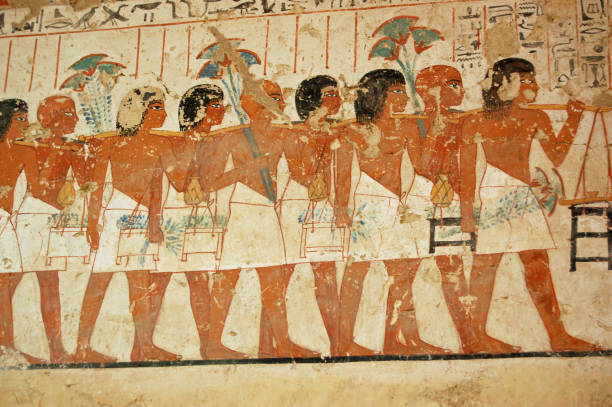 Men in funeral procession, Ancient Egyptian Tomb mural Ancient Egyptian mural showing men taking part in a funeral procession on the wall of the tomb of the  ancient Egyptian Vizier Ramose in the Sheikh Abd el-Qurna, part of the Theban Necropolis, on the west bank of the Nile, opposite to Luxor.  Ancient painting thousands of years old. fresco stock pictures, royalty-free photos & images