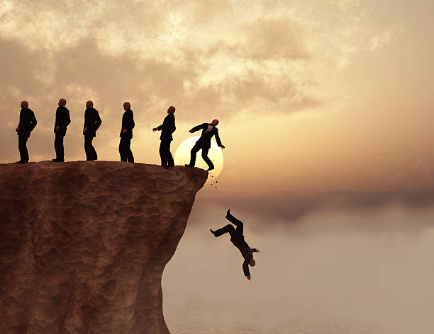 Men on a cliff stock photo