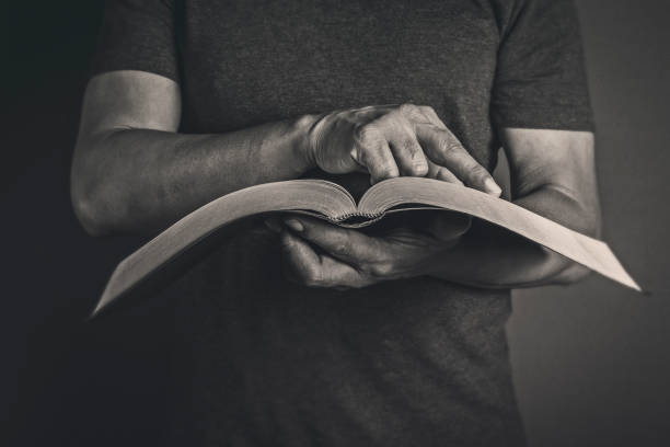 Men reading the Holy Bible stock photo