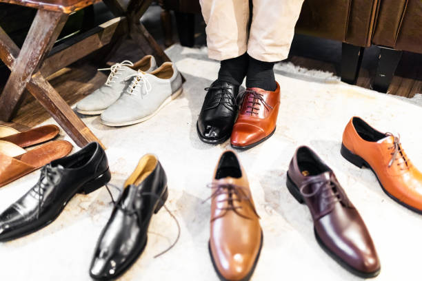 Men Trying different shoes stock photo