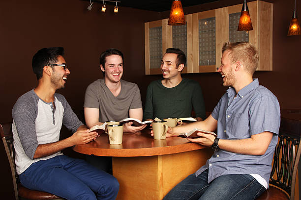 Men's Group Bible Study Diverse Group of Men in a Bible Study at a Cafe only men stock pictures, royalty-free photos & images