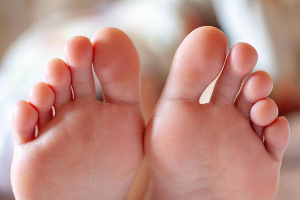 Men's toes, healthy toe nails young girl's toes are healthy and beautiful. Well-groomed toes. Concept for medical articles and ointments - the image of the toes and feet. Image of legs with space for inscriptions and advertising. man pedicure stock pictures, royalty-free photos & images