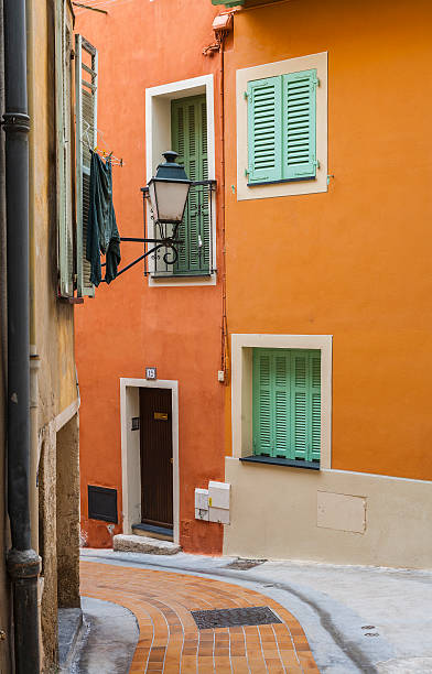 Menton (France). Old town. Street with streetlamp and hanging clothes stock photo