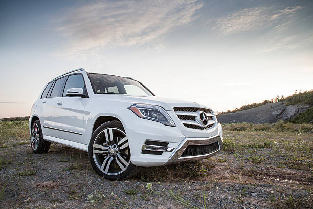 Mercedes GLK250 Dartmouth, Nova Scotia, Canada - August 1, 2015: Mercedes GLK250 parked on a dirt surface.  The Mercedes GLK250 BlueTEC turbodiesel is a luxury crossover that is rated at 200-hp, with 369 lb-ft of torque. The first GLK series vehicle went on sale for the 2008 model year and continued to the 2015 model year. mercedes benz stock pictures, royalty-free photos & images