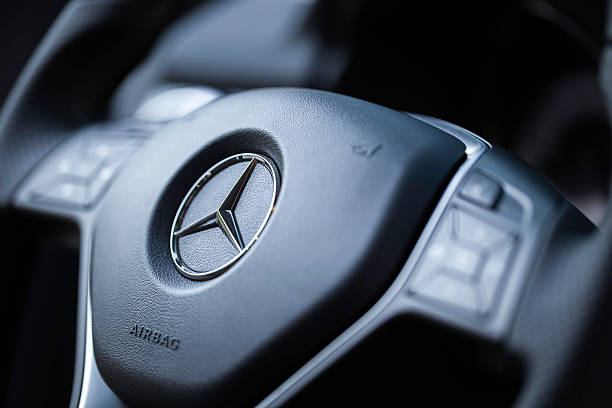 Mercedes Steering Wheel Dartmouth, Nova Scotia, Canada - August 1, 2015: Mercedes steering wheel with user controls in a Mercedes GLK250.  The Mercedes GLK250 BlueTEC turbodiesel is a luxury crossover that is rated at 200-hp, with 369 lb-ft of torque. The first GLK series vehicle went on sale for the 2008 model year and continued to the 2015 model year. mercedes benz stock pictures, royalty-free photos & images