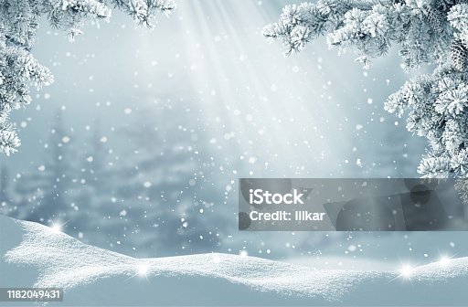 istock Merry Christmas and happy new year greeting card. Winter landscape with snow .Christmas background with fir tree branch 1182049431