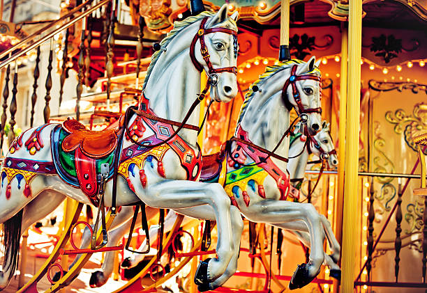 Merry-go-around "Traditional Merry-go-around carousel horses in Avignon, France" carousel horses stock pictures, royalty-free photos & images