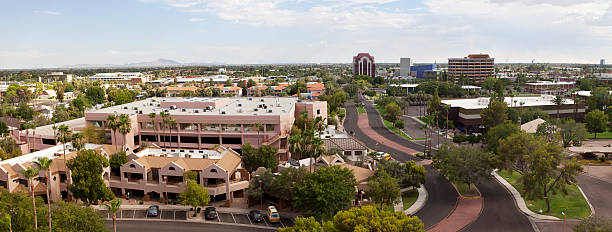 Mesa Arizona Skyline Panorama "View looking southeast, with Mesa Arts Center in the background (the blue building) and parking garage in the foreground." mesa stock pictures, royalty-free photos & images