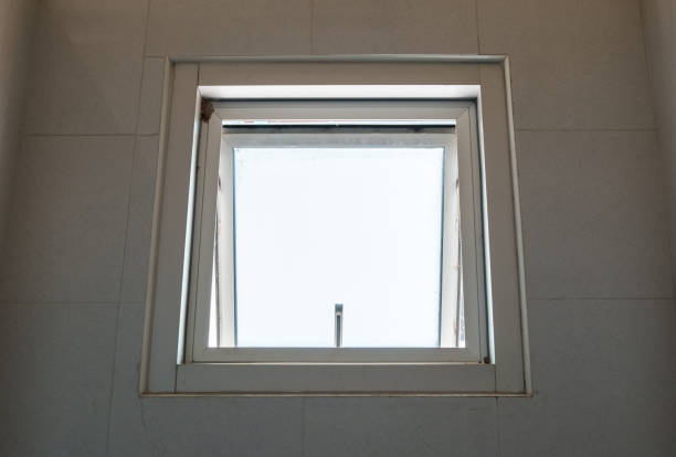 Metal awning window is opening. Metal awning window is opening from inside in the buplic bathroom. awning window stock pictures, royalty-free photos & images