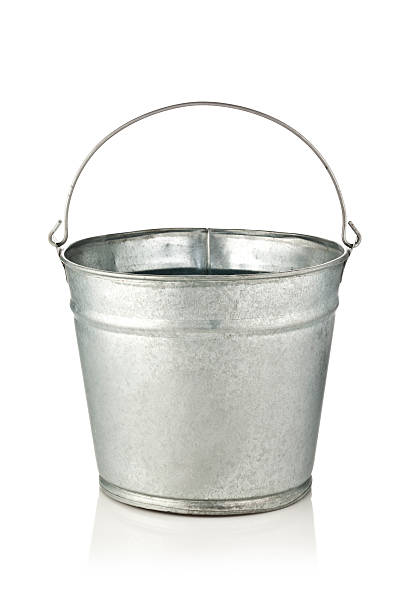 Metal Bucket Old metal bucket isolated on reflective white background bucket stock pictures, royalty-free photos & images