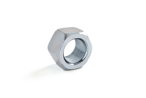 metal fastening nut on a white background close-up