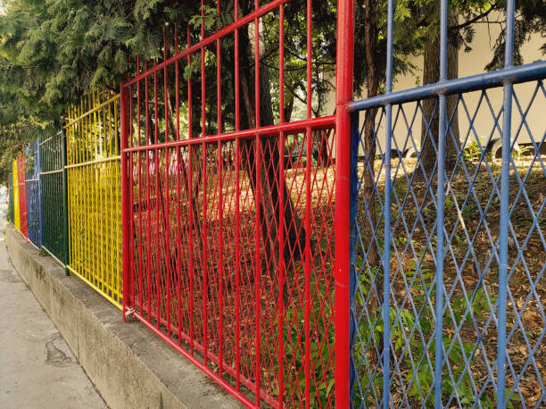Metal fence in various colors stock photo