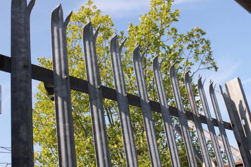 Metal Fence with sharp spikes on top for security
