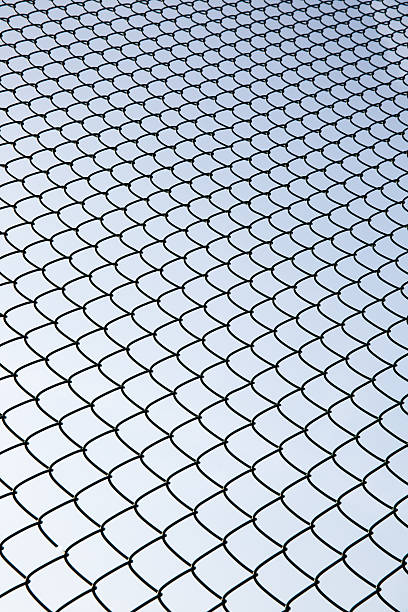 Metal Mesh and sky Metal Mesh and sky linkage effect stock pictures, royalty-free photos & images
