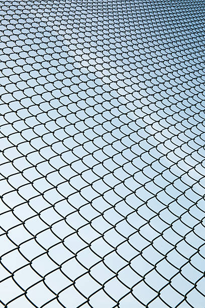 Metal Mesh and sky Metal Mesh and sky linkage effect stock pictures, royalty-free photos & images