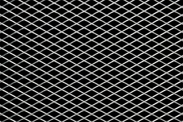 Metal mesh plating isolated against a black background Metal mesh plating isolated against a black background - Grid linkage effect stock pictures, royalty-free photos & images
