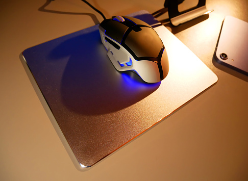 A metal pad for a computer mouse. Stylish mouse pad made of metal and eco-leather.