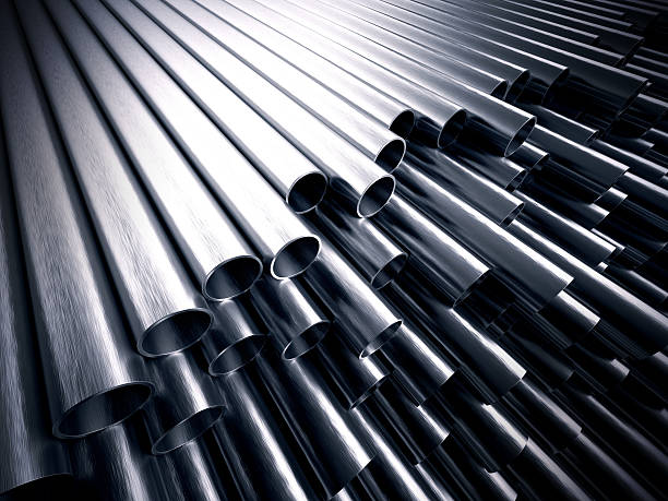 Metal pipes A stack of steel metal tubes with shiny reflections on them alloy stock pictures, royalty-free photos & images
