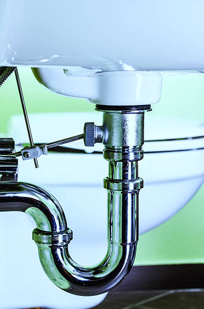 Metal siphon under a sink Siphon under a sink. siphon stock pictures, royalty-free photos & images