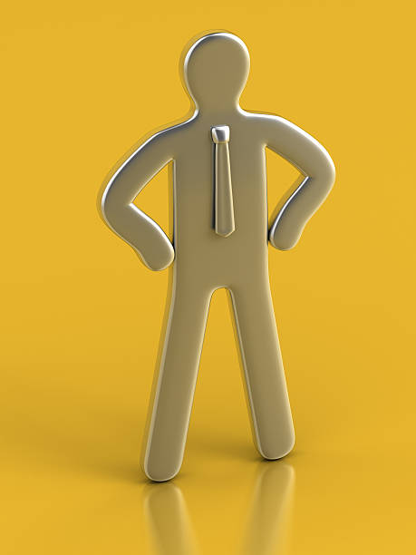 Metallic Figurine against yellow background stock photo