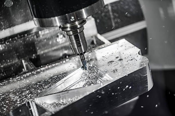 Metalworking CNC milling machine. Metalworking CNC milling machine. Cutting metal modern processing technology. Small depth of field. Warning - authentic shooting in challenging conditions. A little bit grain and maybe blurred. metalwork stock pictures, royalty-free photos & images