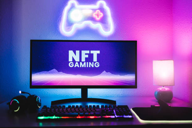 Metaverse and Blockchain Technology Concept - Gaming room displaying NFT marketplace on computer screen - Focus on monitor stock photo