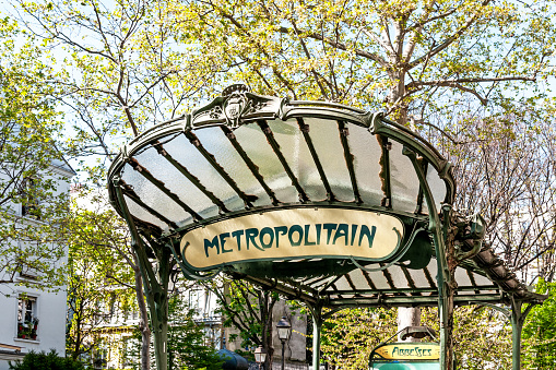 Paris : Metro entrance in art nouveau style. Station at Abbesses (Montmartre), one of the most beautiful metro entrance. Paris, near Montmartre, France - Avril 24, 2021.