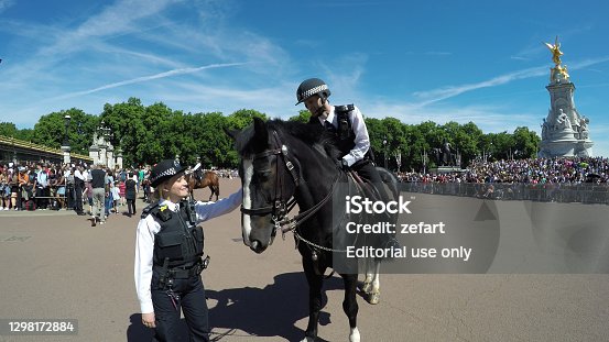 istock Metropolian Police on their horses keeping the Buckingham Palace safe from terrorists during Guard Change Ceremony 1298172884