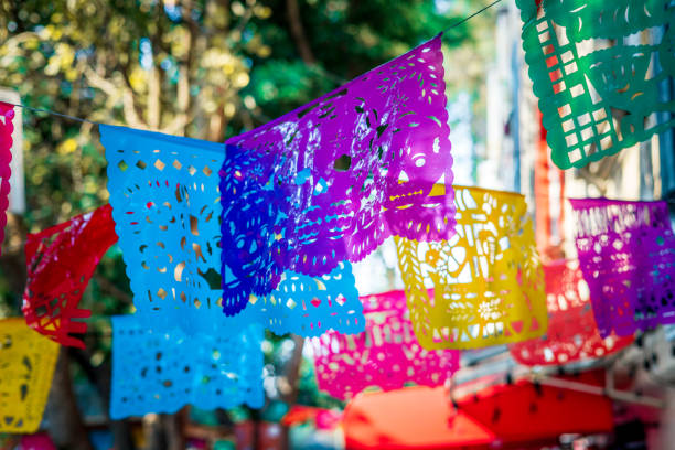 Mexican cut paper hanging over a sidewalk in Mexico City, Mexico