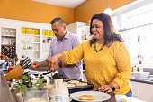 istock Mexican Family Making Breakfast 1384355995