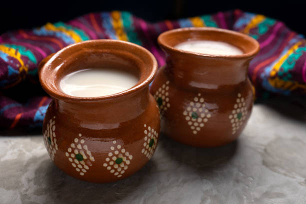 Mexican fermented beverage called pulque on a gray background stock photo