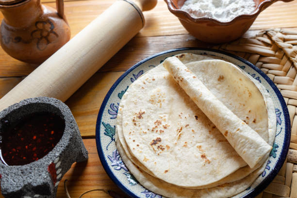 Mexican flour tortillas with cheese and salsa stock photo