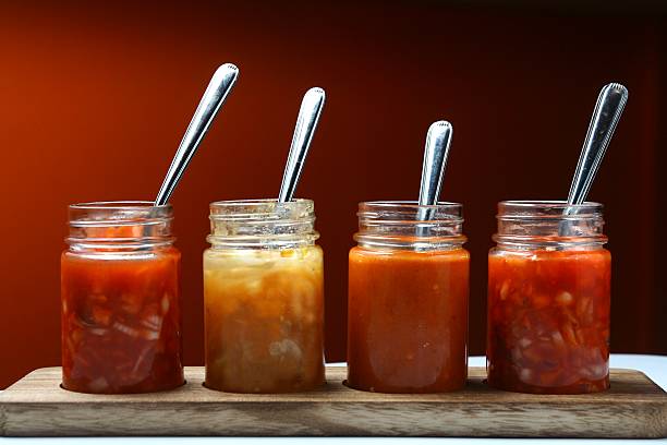 Mexican food dips and sauces in bottles stock photo