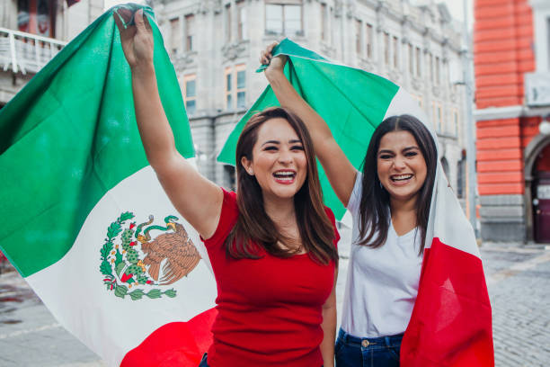 mexican girls friends at independence day in Mexico holding a flag of mexico  mexican independence day images stock pictures, royalty-free photos & images