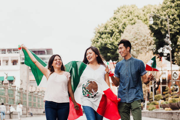 mexican guys cheering Viva Mexico on independence day in Mexico city  mexican independence day images stock pictures, royalty-free photos & images