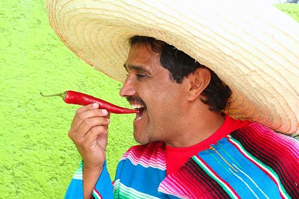 mexican-man-poncho-sombrero-eating-red-hot-chili-picture-id123078176?k=6&m=123078176&s=612x612&w=0&h=jUBY9SOZnV1hHabABD99_NEGANihC-SripvHuDCFY44=