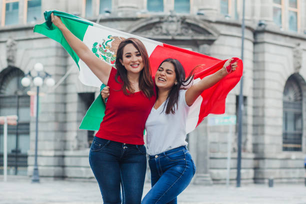 Mexican soccer fans with mexican flag outdoors in Mexico  mexican independence day images stock pictures, royalty-free photos & images