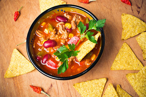 Mexican soup with tacos stock photo