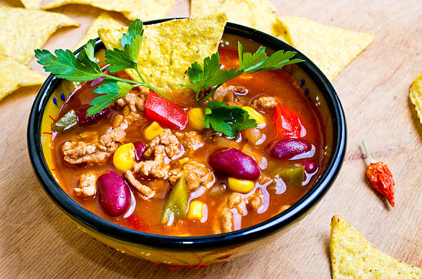 Mexican soup with tacos stock photo