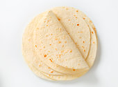 stack of mexican tortillas on a white background