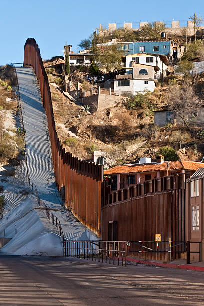 USA - Mexico Border Fence The USA-Mexico Border Fence separates people in Nogales, Arizona, USA from their neighbors and family in Nogales, Sonora, Mexico. jeff goulden border security stock pictures, royalty-free photos & images