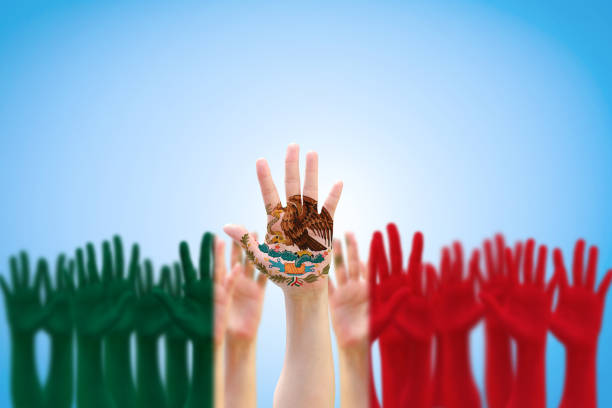 Mexico national flag pattern on people hands raising up for Mexican Independence day celebration and Cinco de Mayo festival  mexican independence day images stock pictures, royalty-free photos & images