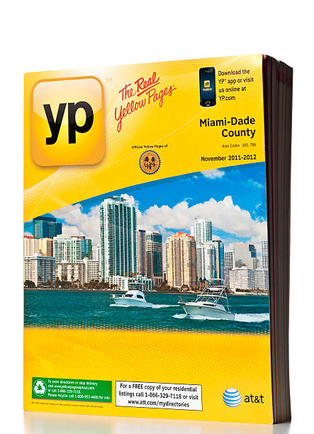 AT&T Miami-Dade County Yellow Pages directory "Miami, USA - March 24, 2012:AT&T Miami-Dade County Yellow Pages directory.  AT&T Yellow Pages is a product of AT&T Advertising Solutions, the dba for the advertising operations of AT&T." white pages directory stock pictures, royalty-free photos & images