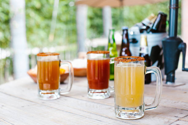 michelada mexican cocktail beer in Mexico city in a mexican party terrace stock photo