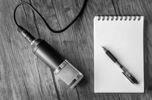 microphone and blank sheet of paper stock photo