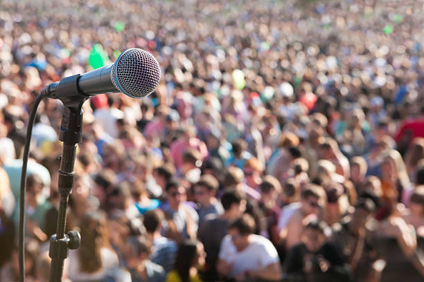 Microphone in front of crowd stock photo