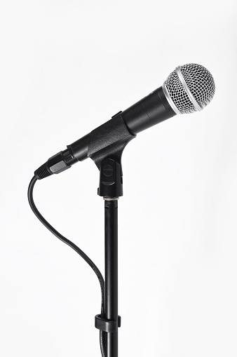 Acoustic microphone on a rack on a white background