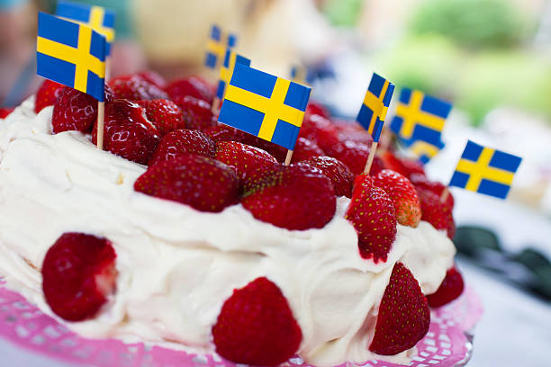 Midsummer cake Strawberry cake for a swedish midsummer celebration. swedish flag photos stock pictures, royalty-free photos & images